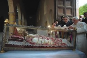Pope Benedict XVI at the foot of Pope Celestine’s tomb at Aquila, Italy on 4 July 2010.