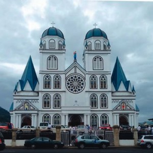 The facade of the  completed Cathedral of the Immaculate Conception, Apia (left) and the interior (above) during the Dedication ceremony