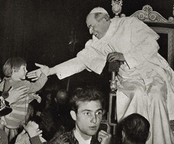 Pope Pius XII blessing a child, 1955