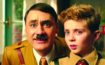 Taika Waititi as Hitler and Roman Griffin Davis