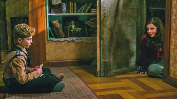 Roman Griffin Davis and Thomasin McKenzie as Elsa